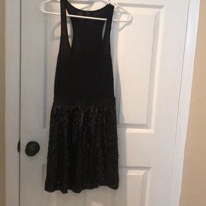 Very pretty black dress with a sequined skirt.